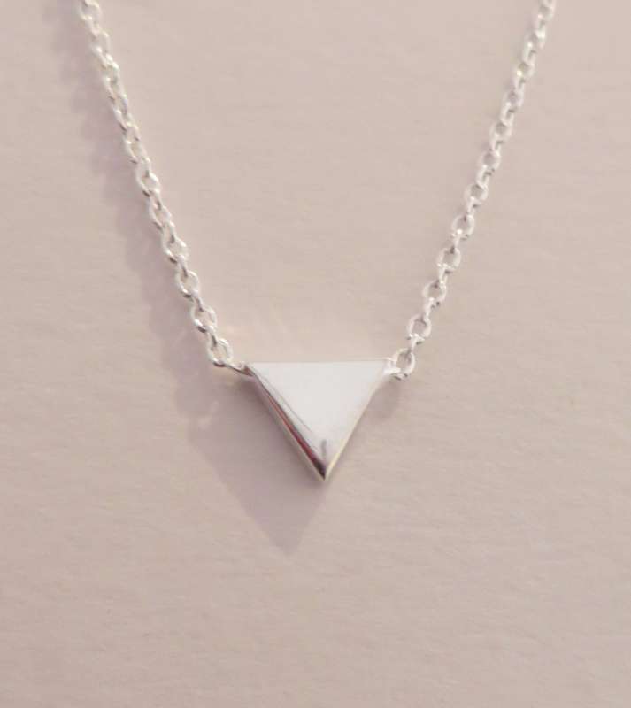Silver pendant with tiny triangle charm